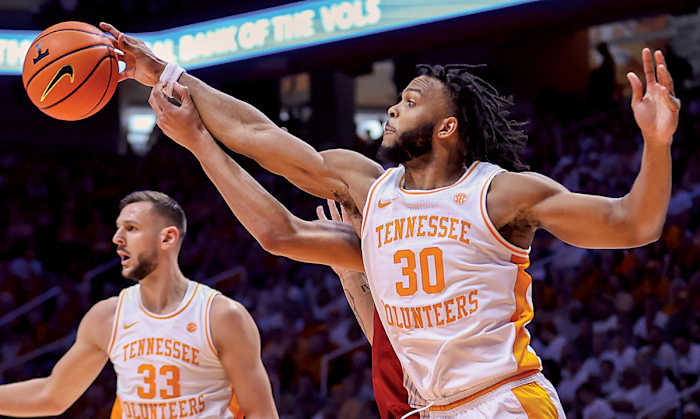 Tennessee Volunteers guard Josiah-Jordan James (30) blocks a shot from Arkansas Razorbacks guard JD Notae (1) during the second half at Thompson-Boling Arena.